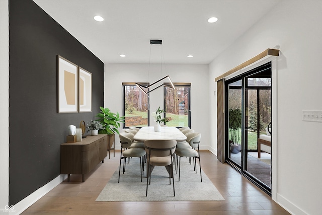 dining area featuring wood-type flooring