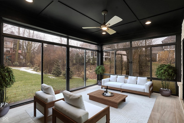 sunroom with ceiling fan and a healthy amount of sunlight