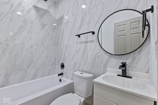 full bathroom featuring vanity, shower / washtub combination, tile walls, and toilet