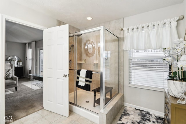 bathroom featuring tile patterned flooring and a shower with door