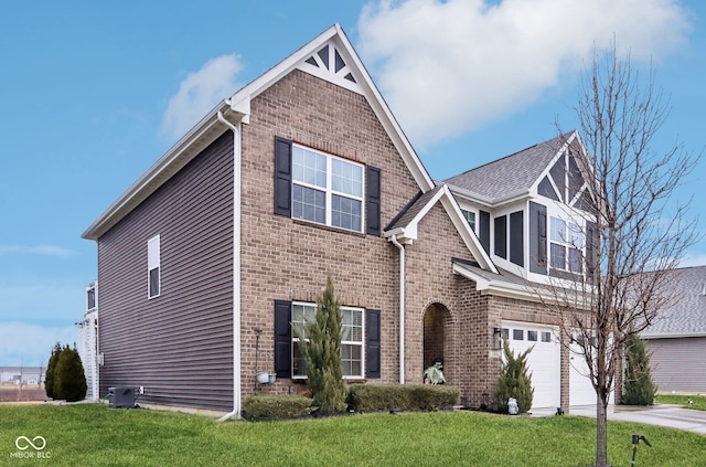 view of front of house with a garage and a front yard