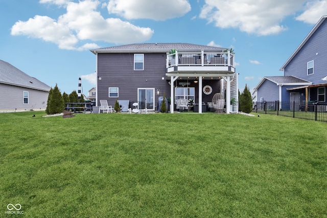 back of house featuring a lawn