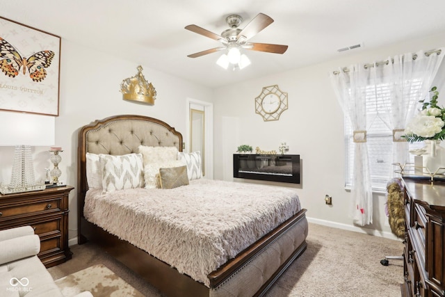 carpeted bedroom with ceiling fan