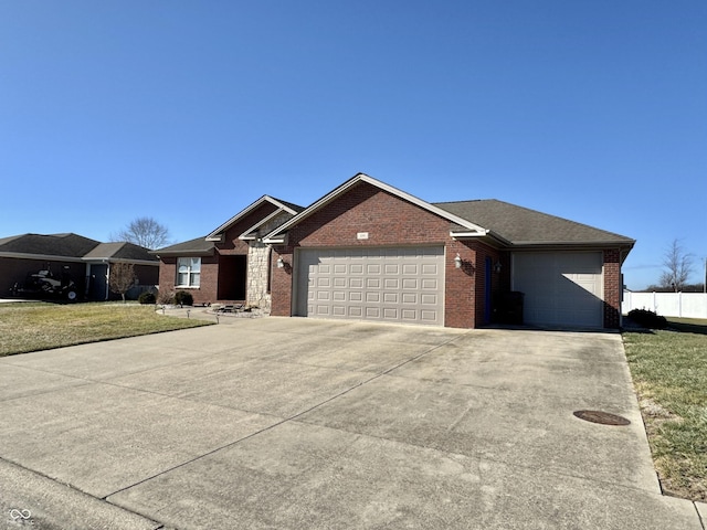 ranch-style house with a garage and a front lawn