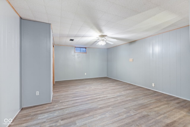 basement featuring light hardwood / wood-style flooring