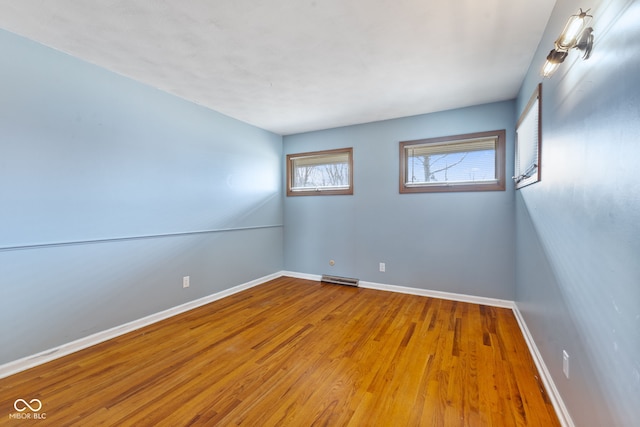 spare room featuring hardwood / wood-style floors