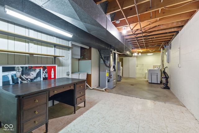 basement featuring heating unit and water heater