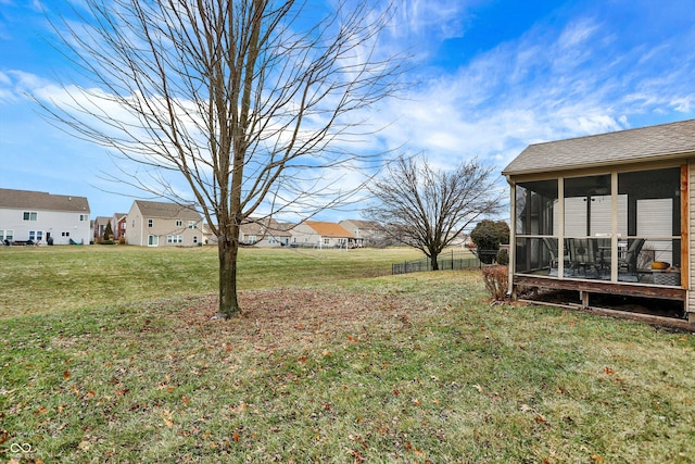 view of yard with a sunroom