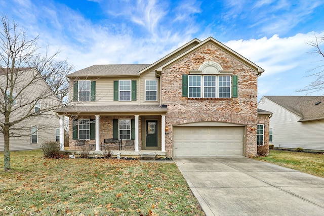 view of property featuring a garage, a front lawn, and a porch