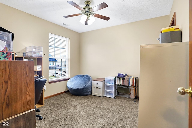 office featuring ceiling fan, carpet floors, and a textured ceiling