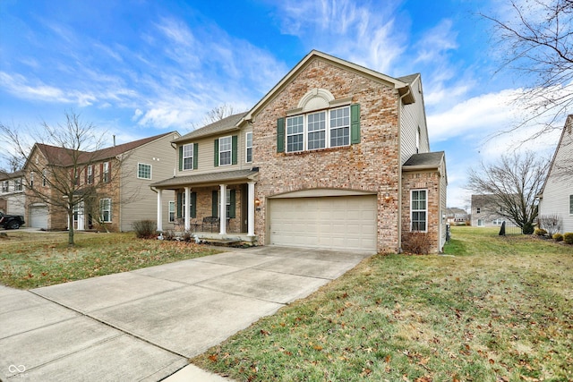 view of property featuring a garage, a front yard, and a porch