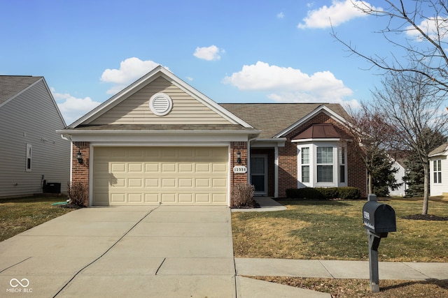 view of front of home with a garage, central AC, and a front yard