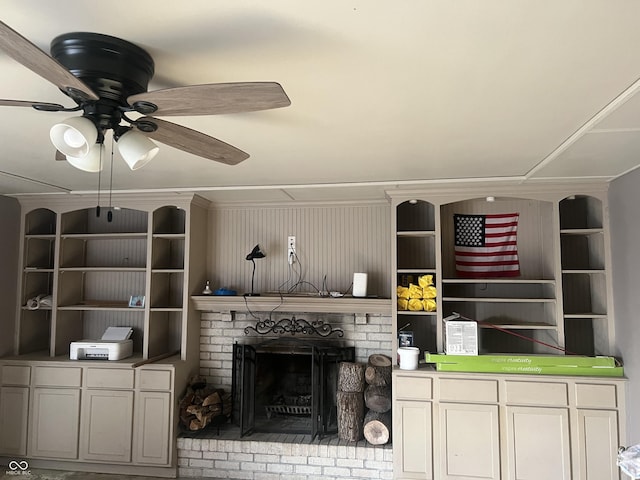 living room featuring ceiling fan and a fireplace