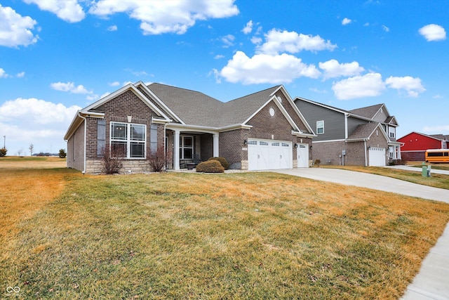 view of front of house with a garage and a front lawn