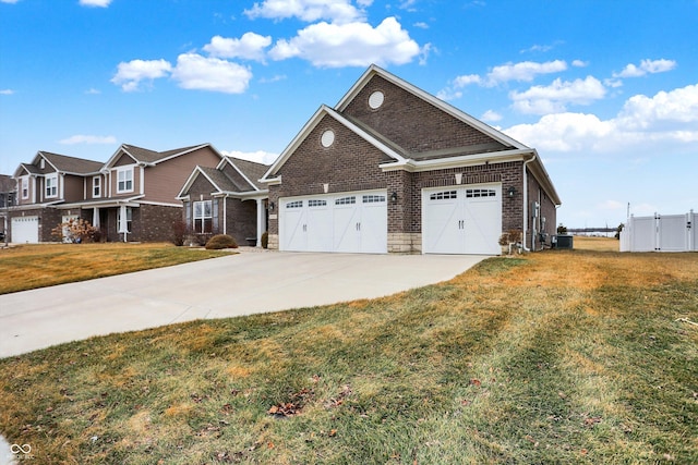 view of front of property featuring a garage, cooling unit, and a front lawn