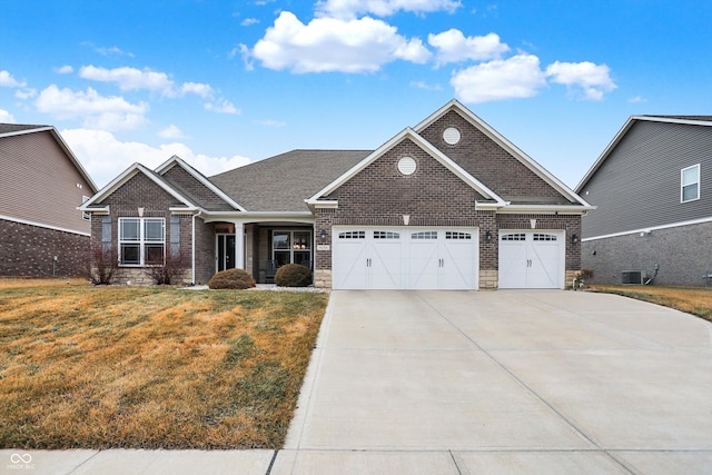 view of front of home featuring a garage and a front lawn