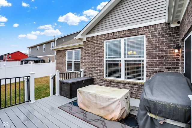 wooden deck with grilling area