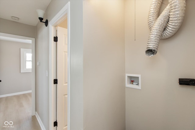 washroom featuring washer hookup, hookup for an electric dryer, and light wood-type flooring