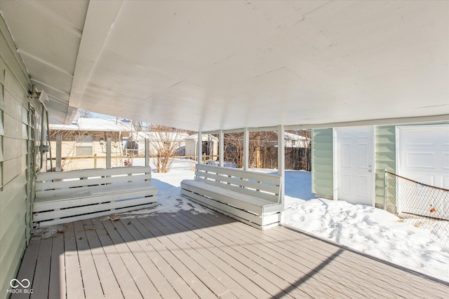 view of snow covered deck