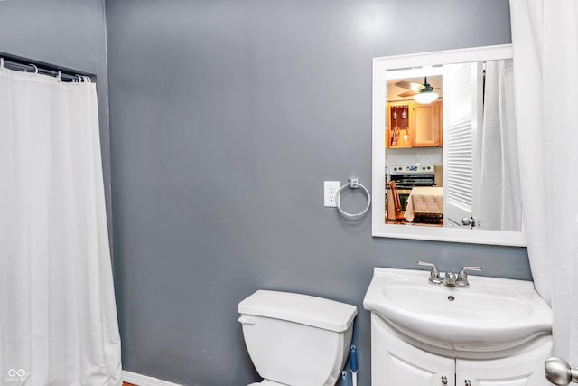 bathroom featuring vanity and toilet