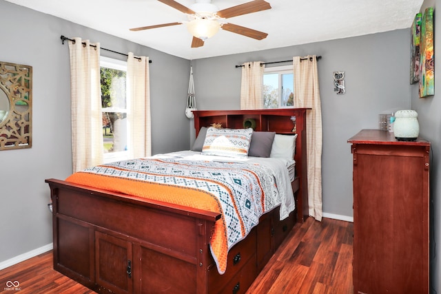 bedroom featuring ceiling fan and dark hardwood / wood-style floors