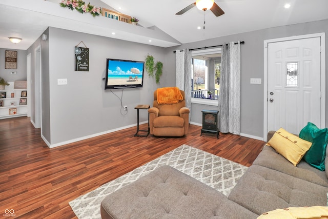 sitting room with lofted ceiling, dark hardwood / wood-style flooring, and ceiling fan