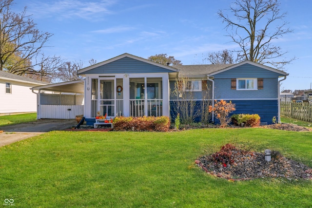 view of front facade with a carport and a front yard