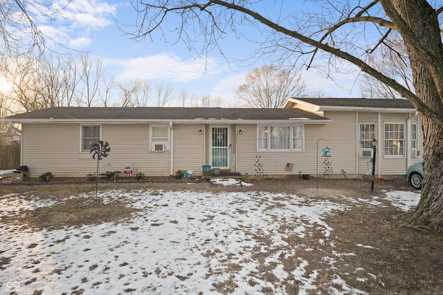 single story home featuring cooling unit