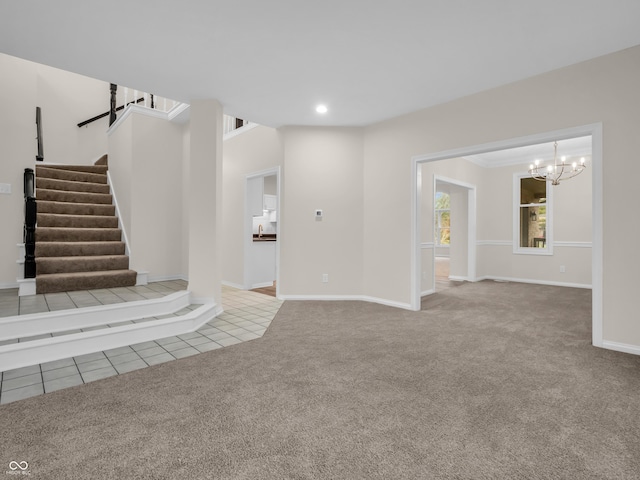 unfurnished living room featuring an inviting chandelier and light colored carpet