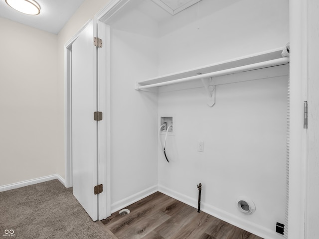 laundry room featuring dark hardwood / wood-style floors and hookup for a washing machine