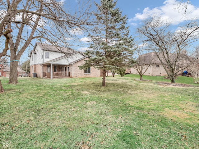 view of yard with covered porch