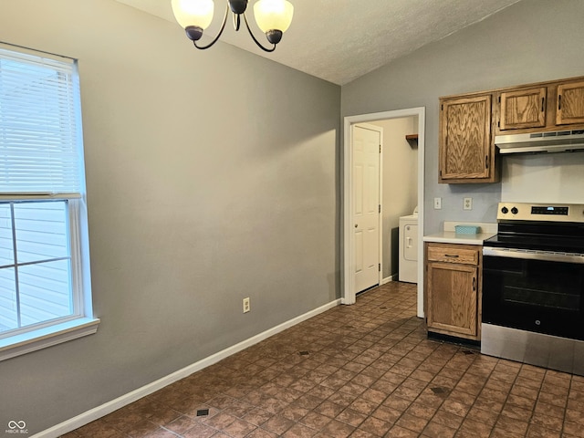 kitchen with washer / dryer, vaulted ceiling, stainless steel electric range, plenty of natural light, and a notable chandelier