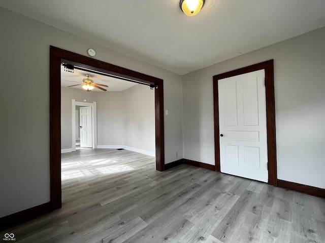 spare room featuring light hardwood / wood-style flooring