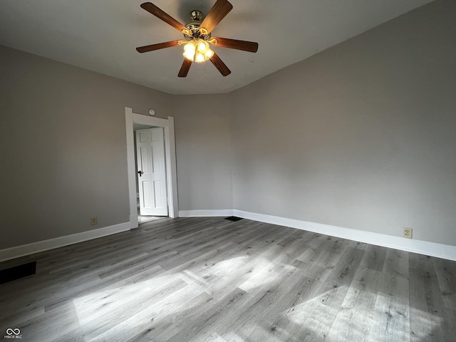 unfurnished room featuring ceiling fan and light hardwood / wood-style flooring