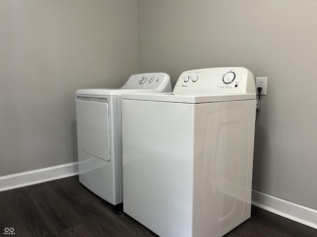 laundry area featuring dark wood-type flooring and washer and dryer