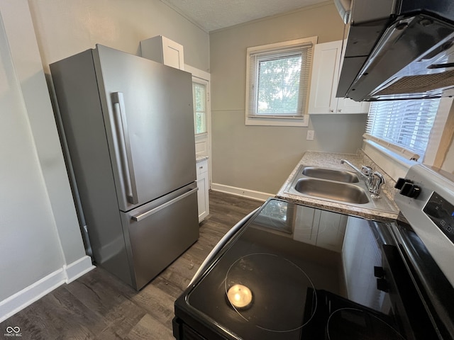 kitchen with sink, white cabinetry, stainless steel appliances, dark hardwood / wood-style flooring, and exhaust hood