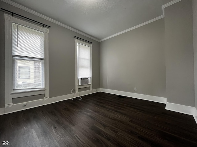 unfurnished room featuring crown molding, cooling unit, and dark hardwood / wood-style flooring