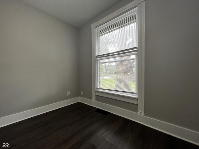 unfurnished room featuring hardwood / wood-style floors