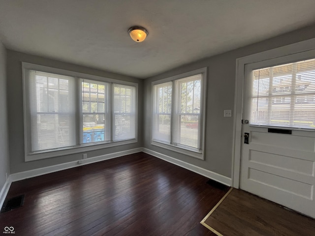 interior space with dark hardwood / wood-style flooring