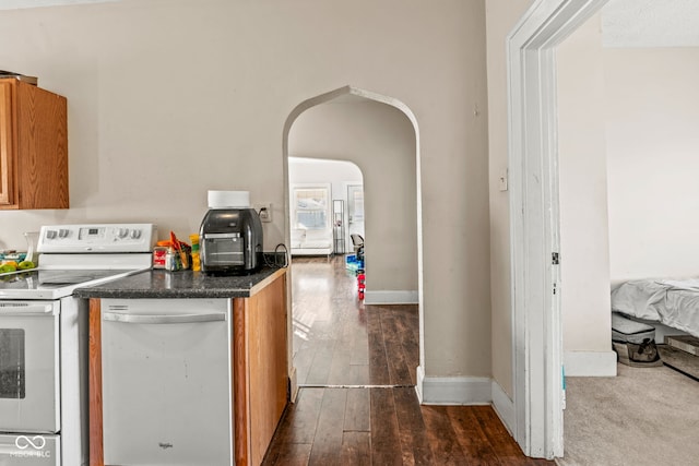 kitchen with dark wood-type flooring, white range with electric cooktop, and dishwasher