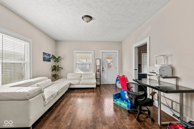 office space with dark wood-type flooring and a textured ceiling