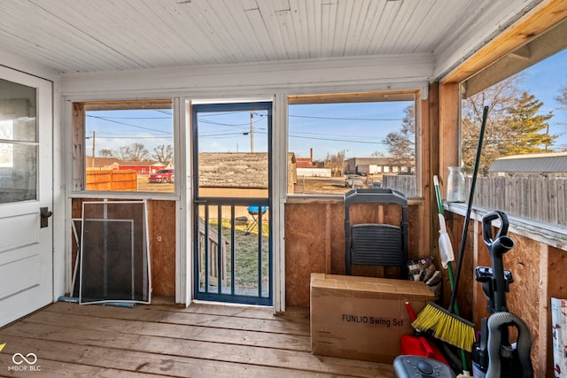 sunroom featuring wood ceiling