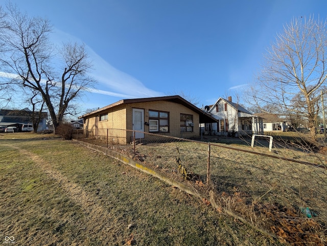 back of house with a yard