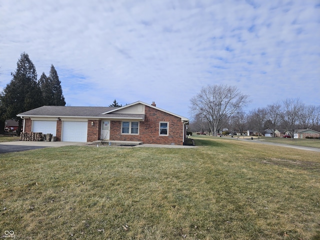 view of front of property with a garage and a front yard