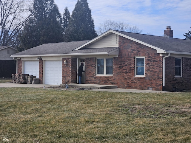 ranch-style house with a garage and a front lawn