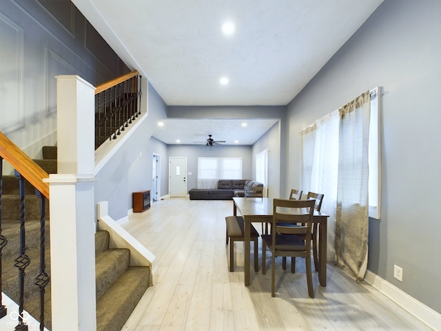 dining space featuring light hardwood / wood-style flooring and ceiling fan