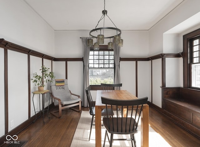 dining area with wood finished floors