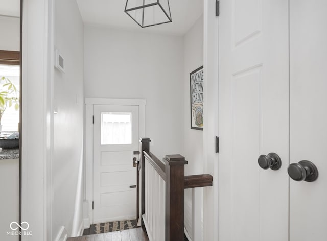 interior space featuring visible vents and wood finished floors