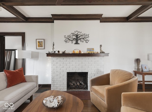 living room featuring wood finished floors, beamed ceiling, a fireplace, and baseboards