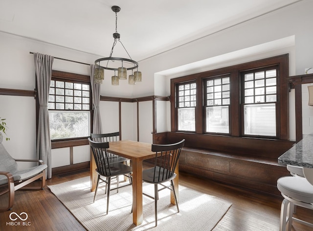 dining space featuring wood-type flooring